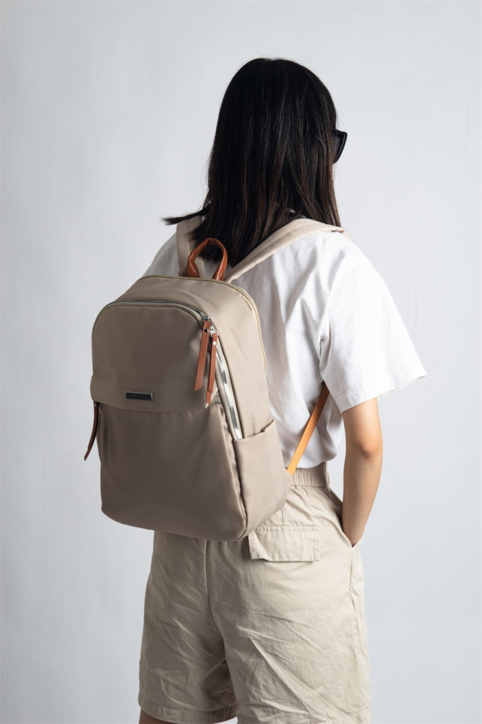 Soft waterproof professional backpack with trolley sleeve and anti-theft pocket, fits 15-inch laptop.