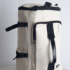 SUPOTSU sporty lightweight backpack in white, worn crossbody or as a backpack with padded shoulder straps.