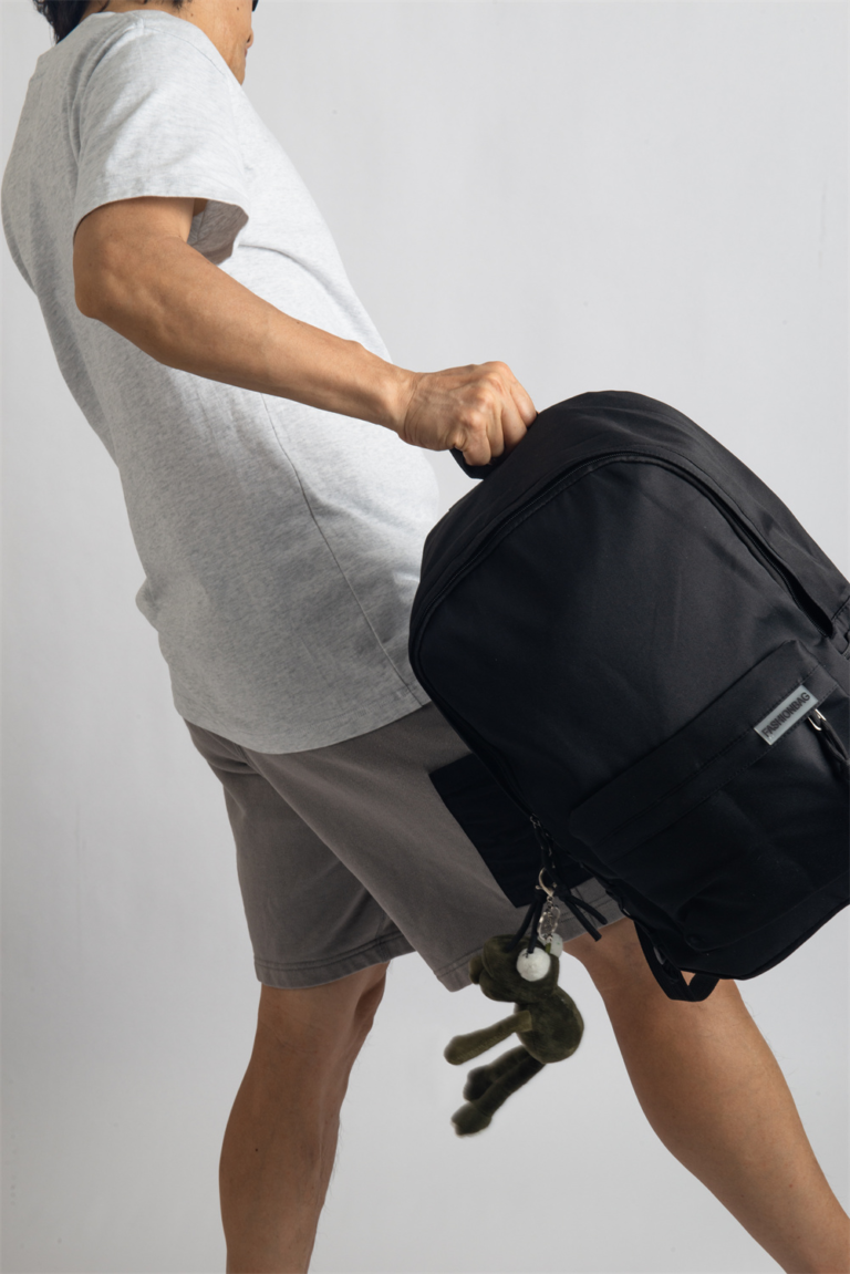 This hip, minimalistic Japanese backpack blends effortlessly with any casual outfit. Perfect for everyday wear, it features dedicated compartments for your laptop, iPad, and phone, keeping your essentials organized. An anti-theft back pocket provides extra security for your wallet and personal items. Style it with our adorable frog bag charm for a playful fashion upgrade.
