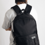 This hip, minimalistic Japanese backpack blends effortlessly with any casual outfit. Perfect for everyday wear, it features dedicated compartments for your laptop, iPad, and phone, keeping your essentials organized. An anti-theft back pocket provides extra security for your wallet and personal items. Style it with our adorable frog bag charm for a playful fashion upgrade.