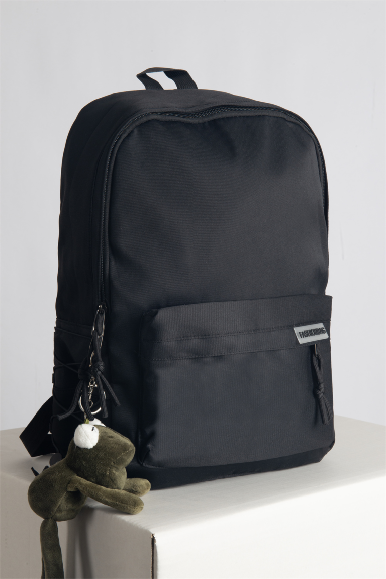 This hip, minimalistic Japanese backpack blends effortlessly with any casual outfit. Perfect for everyday wear, it features dedicated compartments for your laptop, iPad, and phone, keeping your essentials organized. An anti-theft back pocket provides extra security for your wallet and personal items. Style it with our adorable frog bag charm for a playful fashion upgrade.