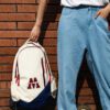 The MVP backpack blends vintage American flair with modern function. Red and blue details, multiple pockets, and a trolley sleeve make it ideal for everyday travel.
