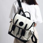 COCO blends British sophistication with Japanese minimalism in a vintage-style backpack perfect for work or school. Crafted from soft, smooth, and durable materials, it comfortably fits a 13.3'' laptop along with your everyday essentials—offering both elegance and practicality.