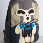KANGA is a cute and playful backpack featuring a gray and beige colorway, a unique kangaroo print, and a secure back iPad pocket—perfect for autumn and winter fashion.