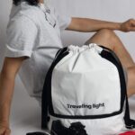 RYOKO is your go-to backpack for gym days and travel adventures. Whether you're heading to a soccer game or preparing for scuba diving, this sleek and functional backpack helps you travel light. It features a separate bottom compartment for shoes and an interior divider for wet and dry items. Made from stain-resistant material, RYOKO maintains its fresh, polished look even with frequent use.