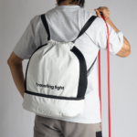 RYOKO is your go-to backpack for gym days and travel adventures. Whether you're heading to a soccer game or preparing for scuba diving, this sleek and functional backpack helps you travel light. It features a separate bottom compartment for shoes and an interior divider for wet and dry items. Made from stain-resistant material, RYOKO maintains its fresh, polished look even with frequent use.
