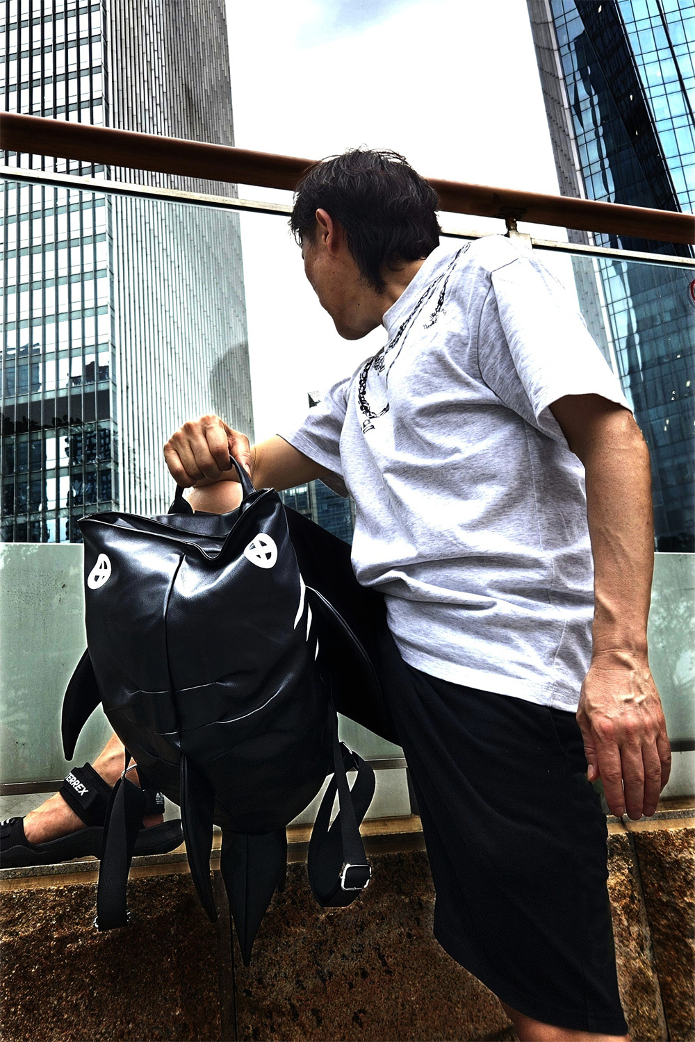 Make a bold statement with the SHARK-SAN backpack. Featuring a striking shark-inspired design and crafted from lightweight, waterproof material, this compact bag offers just enough room for your phone, wallet, and a small water bottle—perfect for casual meetups and stylish adventures.
