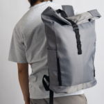 WORK GEN is a modern roll-top backpack designed for comfort and capacity. Its ergonomic shoulder straps and breathable back panel reduce strain, making it ideal for long commutes or busy workdays. Spacious enough to hold a 15.6'' laptop, headset, and daily office essentials, this lightweight bag blends function with smart design.