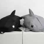 Our signature shark backpacks are designed for those who find traditional bags boring. Featured here in sleek black and stone gray, these bags boast a bold 3D fin design and minimalist 'X' eye detailing. It’s the ultimate unconventional accessory for youth who live for Japanese-inspired, standout style.