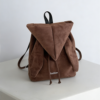 Korean style backpack brings out your Kpop idol energy. This brown backpack is lightweight and small with bunny ears design. It has a drawstring design and can be converted into a chic crossbody bag.