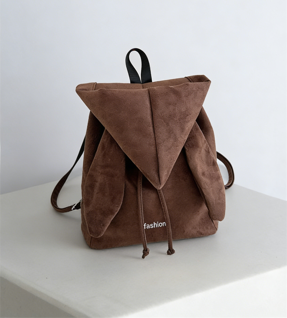 Korean style backpack brings out your Kpop idol energy. This brown backpack is lightweight and small with bunny ears design. It has a drawstring design and can be converted into a chic crossbody bag.