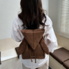 Korean style backpack brings out your Kpop idol energy. This brown backpack is lightweight and small with bunny ears design. It has a drawstring design and can be converted into a chic crossbody bag.