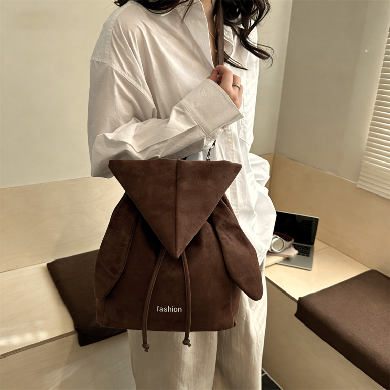 Korean style backpack brings out your Kpop idol energy. This brown backpack is lightweight and small with bunny ears design. It has a drawstring design and can be converted into a chic crossbody bag.