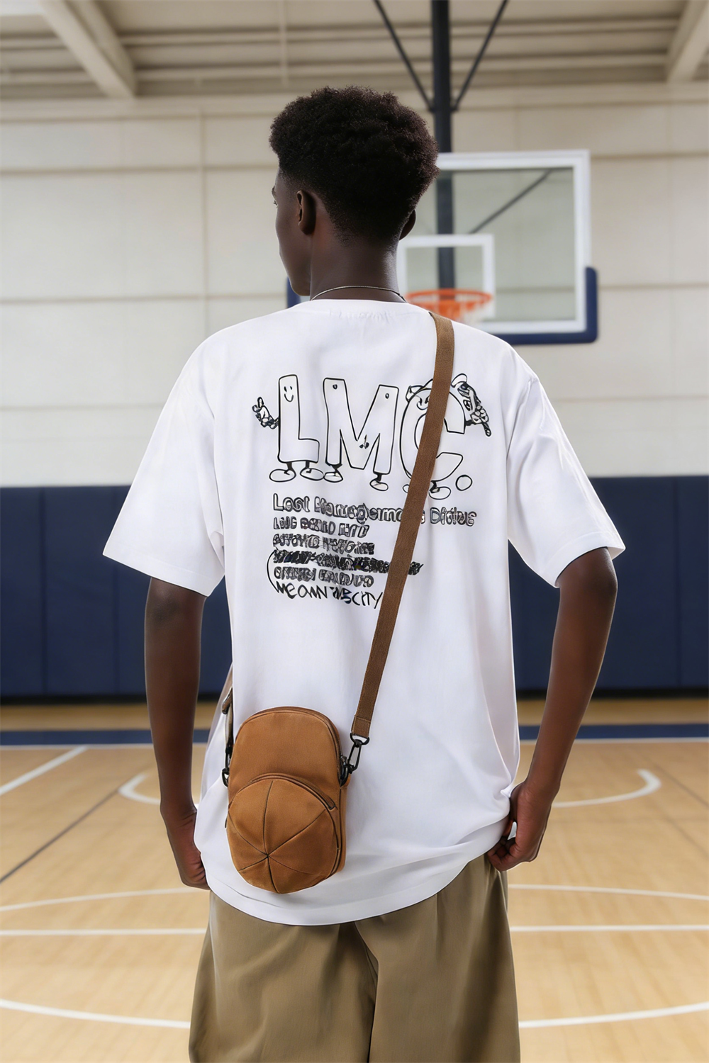 An American high schooler wearing the HATTO mustard yellow mini crossbody bag while standing on the school basketball court.